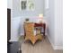 A bright and cozy office nook featuring a wicker chair, red desk, and ample natural light at 1225 Blakeway St # 403, Charleston, SC 29492