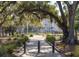 Exterior view of a park featuring a playground, trees, plants, walking path and benches at 1225 Blakeway St # 403, Charleston, SC 29492
