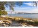 Tranquil view of the water and a bridge beyond the sandy beach at 1225 Blakeway St # 403, Charleston, SC 29492