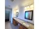 Bathroom with double sinks, granite countertop, and framed mirrors at 126 Shadybrook Dr, Summerville, SC 29486