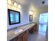 Bathroom with double sinks, granite countertop, and framed mirrors at 126 Shadybrook Dr, Summerville, SC 29486