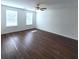 Bright bedroom featuring wood-look flooring, ceiling fan, and natural light at 126 Shadybrook Dr, Summerville, SC 29486