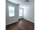 Bright bedroom with wood floors, windows, and neutral paint at 126 Shadybrook Dr, Summerville, SC 29486