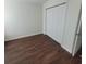 Bedroom featuring laminate floors, white walls and a closet with bi-fold doors at 126 Shadybrook Dr, Summerville, SC 29486