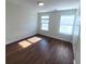 Bedroom with wood floors, windows, closet, and neutral paint at 126 Shadybrook Dr, Summerville, SC 29486