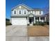 Charming two-story home with a well-manicured lawn, two car garage, and classic architectural details at 126 Shadybrook Dr, Summerville, SC 29486