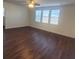 Bright and spacious living room featuring a ceiling fan and three large windows at 126 Shadybrook Dr, Summerville, SC 29486