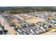 Aerial view showcases a home's location within a neighborhood, highlighting nearby community amenities and surroundings at 127 Country Gate Ln, Summerville, SC 29485