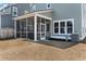 Backyard features a screened-in porch, well-maintained lawn, and home with siding at 127 Country Gate Ln, Summerville, SC 29485