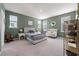 Spacious bedroom with lots of natural light, a stylish bed frame, and neutral colored carpet at 127 Country Gate Ln, Summerville, SC 29485