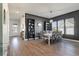 Spacious dining room with a large table, seating for eight, and modern lighting, ideal for Gathering gatherings at 127 Country Gate Ln, Summerville, SC 29485