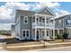 Beautiful two-story home with a charming front porch and gray siding at 127 Country Gate Ln, Summerville, SC 29485