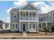 Charming two-story home with a welcoming front porch and a classic gray exterior at 127 Country Gate Ln, Summerville, SC 29485