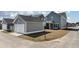 View of the home's exterior and detached garage, showcasing its architectural style and well-maintained surroundings at 127 Country Gate Ln, Summerville, SC 29485