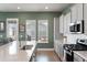 Modern kitchen with gray cabinets, stainless steel appliances, white backsplash and long countertop at 127 Country Gate Ln, Summerville, SC 29485
