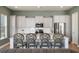 Eat-in kitchen features white cabinets, stainless appliances, and island with bar stool seating at 127 Country Gate Ln, Summerville, SC 29485