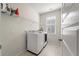 Laundry room featuring tile floors, a large window, and washer and dryer at 127 Country Gate Ln, Summerville, SC 29485