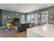 Comfortable living room with green walls, plush seating, and bright natural light at 127 Country Gate Ln, Summerville, SC 29485