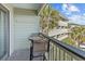 Relaxing balcony view with a table, chairs, and coastal ambiance at 1300 Ocean Blvd # 238, Isle of Palms, SC 29451