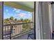 Balcony area with seating and a view of palm trees and a clear blue sky at 1300 Ocean Blvd # 238, Isle of Palms, SC 29451