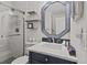 Bathroom featuring glass shower, vanity, modern fixtures and decorative mirror at 1300 Ocean Blvd # 238, Isle of Palms, SC 29451