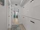 Bright hallway with built-in storage and a view into the living area at 1300 Ocean Blvd # 238, Isle of Palms, SC 29451