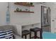 Kitchen bar area with seating, stainless steel refrigerator, and decor shelving at 1300 Ocean Blvd # 238, Isle of Palms, SC 29451