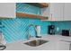 Close up of the kitchen sink area with white countertop and accent backsplash at 1300 Ocean Blvd # 238, Isle of Palms, SC 29451