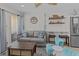 Living room with comfortable seating and access to the kitchenette area at 1300 Ocean Blvd # 238, Isle of Palms, SC 29451