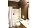 Cozy bathroom with a shower-tub combination, framed mirror, and earth-tone accents at 1346 Ashley Gardens Blvd, Charleston, SC 29414