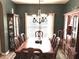 Dining room boasting a large wooden table with seating for eight, under a chandelier at 1346 Ashley Gardens Blvd, Charleston, SC 29414