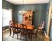 Formal dining room featuring an elegant chandelier, classic wooden furniture, and serene green walls at 1346 Ashley Gardens Blvd, Charleston, SC 29414