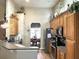 Well-equipped kitchen with stainless steel appliances, wooden cabinets and view into dining room at 1346 Ashley Gardens Blvd, Charleston, SC 29414