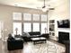 Spacious living room with high ceilings, fireplace and large windows filling the space with light at 1346 Ashley Gardens Blvd, Charleston, SC 29414