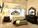 Inviting main bedroom suite with dark wood furniture, large window and ample natural light at 1346 Ashley Gardens Blvd, Charleston, SC 29414