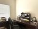 Well-lit home office with a classic wooden desk and organized storage solutions at 1346 Ashley Gardens Blvd, Charleston, SC 29414