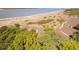 Aerial view of property showing beach access, mature trees, and beautiful coastline at 1346/48 Pelican Watch, Seabrook Island, SC 29455