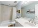 Bathroom with light blue walls and a marble countertop vanity with framed artwork at 1346/48 Pelican Watch, Seabrook Island, SC 29455