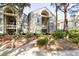 Attractive exterior elevation with lush landscaping and private entrances to each unit at 1346/48 Pelican Watch, Seabrook Island, SC 29455