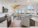 Modern kitchen with stainless appliances, a breakfast bar, and an open floorplan design at 1346/48 Pelican Watch, Seabrook Island, SC 29455