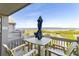 Outdoor patio with dining table and an umbrella with stunning views of the ocean at 1346/48 Pelican Watch, Seabrook Island, SC 29455