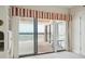 Wonderful water views from a private balcony are seen through glass sliding doors from inside a room at 1401 Ocean Club Dr, Isle of Palms, SC 29451