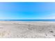 Serene ocean views with sandy beaches meet crystal clear skies on a sunny day at 1401 Ocean Club Dr, Isle of Palms, SC 29451