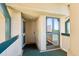Condo front door with a storm door and view of the exterior through a window at 1401 Ocean Club Dr, Isle of Palms, SC 29451