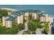 An aerial view of building, trees, foliage, and parking spaces at 1401 Ocean Club Dr, Isle of Palms, SC 29451