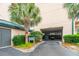 Private parking garage entrance with lush landscaping for tenants and visitors at 1401 Ocean Club Dr, Isle of Palms, SC 29451