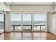 Condo living room with ocean views, built-in shelving, fireplace, and floor to ceiling windows at 1401 Ocean Club Dr, Isle of Palms, SC 29451