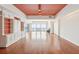 Open-concept living area with beautiful hardwood floors, custom built-ins, and views of the ocean at 1401 Ocean Club Dr, Isle of Palms, SC 29451