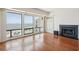 Bright living room offers scenic ocean views, cozy fireplace, built-ins and wood flooring at 1401 Ocean Club Dr, Isle of Palms, SC 29451