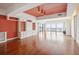 Spacious living room features beautiful hardwood floors, built-in shelving, and ocean views at 1401 Ocean Club Dr, Isle of Palms, SC 29451